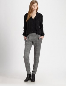 Fluid, '60s-inspired blouse with long bishop sleeves and a front self tie, modernized by a back cutout detail. V-neck with self tieButton frontLong bishop sleeves with buttoned cuffsBack cutoutCuproDry cleanMade in USA of imported fabricModel shown is 5'10 (177cm) wearing US size 2. Fluid, '60s-inspired blouse with long bishop sleeves and a front self tie, modernized by a back cutout detail. V-neck with self tieButton frontLong bishop sleeves with buttoned cuffsBack cutoutCuproDry cleanMade in USA of imported fabricModel shown is 5'10 (177cm) wearing US size 2.