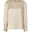 Sophisticated and sexy top in fine champagne-colored silk - Narrow, straight cut creates a sleek look - Features a rounded neck, long sleeves and rounded hem - Decorative full placket at back - Style with skinny jeans, pencil skirt or leather pants