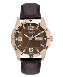 Exude confidence with the contemporary vibe of this watch by Caravelle by Bulova. Brown croc-embossed leather strap and round rose-gold tone stainless steel case. Brown dial with square textured inner dial features applied rose-gold tone numerals at twelve, six and nine o'clock, stick indices, minute track, date window at three o'clock, luminous hands and logo. Quartz movement. Water resistant to 30 meters. Two-year limited warranty. Exude confidence with the contemporary vibe of this watch by Caravelle by Bulova. Brown croc-embossed leather strap and round rose-gold tone stainless steel case. Brown dial with square textured inner dial features applied rose-gold tone numerals at twelve, six and nine o'clock, stick indices, minute track, date window at three o'clock, luminous hands and logo. Quartz movement. Water resistant to 30 meters. Two-year limited warranty.