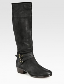 Rich pebble-grain leather forms this tall silhouette, topped with equestrian-inspired hardware. Stacked heel, 1¾ (45mm)Shaft, 16½Leg circumference, 15½Leather upperSide zipAnkle strap with adjustable metal pull-tabsLeather lining and solePadded insoleImported Rich pebble-grain leather forms this tall silhouette, topped with equestrian-inspired hardware. Stacked heel, 1¾ (45mm)Shaft, 16½Leg circumference, 15½Leather upperSide zipAnkle strap with adjustable metal pull-tabsLeather lining and solePadded insoleImported