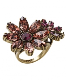 Chic and colorful. Sparkling crystals in vibrant shades of pink and purple stand out on Fossil's unique double-daisy silhouette ring. Made in gold tone mixed metal, it has an eye-catching effect for day or evening. Size 7. Chic and colorful. Sparkling crystals in vibrant shades of pink and purple stand out on Fossil's unique double-daisy silhouette ring. Made in gold tone mixed metal, it has an eye-catching effect for day or evening. Size 7.