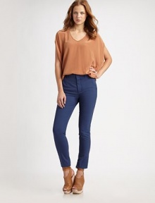 Shimmering silk v-neck in an oversized silhouette with open three-quarter sleeves. V-neckOpen three-quarter sleevesLonger length hits below the hipsSilkDry cleanImported Shimmering silk v-neck in an oversized silhouette with open three-quarter sleeves. V-neckOpen three-quarter sleevesLonger length hits below the hipsSilkDry cleanImported