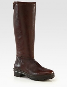 A seasonal favorite rendered in buttery leather, with a back zip closure and rubber trek sole. Rubber heel, 1¼ (30mm)Rubber platform, 1 (25mm)Compares to a ¼ heel (5mm)Shaft, 14½Leg circumference, 14Leather upperBack zip and snap closure at top of shaftLeather liningRubber trek solePadded insoleImported A seasonal favorite rendered in buttery leather, with a back zip closure and rubber trek sole. Rubber heel, 1¼ (30mm)Rubber platform, 1 (25mm)Compares to a ¼ heel (5mm)Shaft, 14½Leg circumference, 14Leather upperBack zip and snap closure at top of shaftLeather liningRubber trek solePadded insoleImported