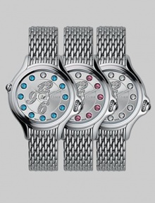 Dazzling topaz stones surround diamond-encrusted numerals on this classic, stainless steel design, featuring a unique rolling gemstone mechanism that changes the semiprecious markers for three different looks, with a single stationary diamond at 12.Swiss quartz movement Water resistant to 3 ATM Round stainless steel case, 38mm, (1.49) Silver dial Topaz and single diamond markers, 2.9 tcw Arabic numeral hour markers Bracelet strap Made in Switzerland Dazzling topaz stones surround diamond-encrusted numerals on this classic, stainless steel design, featuring a unique rolling gemstone mechanism that changes the semiprecious markers for three different looks, with a single stationary diamond at 12.Swiss quartz movement Water resistant to 3 ATM Round stainless steel case, 38mm, (1.49) Silver dial Topaz and single diamond markers, 2.9 tcw Arabic numeral hour markers Bracelet strap Made in Switzerland