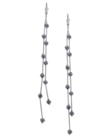 Fire up your evening with these two-row linear earrings from GUESS. Crystal-embellished fireballs hang from metal chains. Crafted in imitation rhodium tone mixed metal. Approximate drop: 7 inches. Fire up your evening with these two-row linear earrings from GUESS. Crystal-embellished fireballs hang from metal chains. Crafted in imitation rhodium tone mixed metal. Approximate drop: 7 inches.