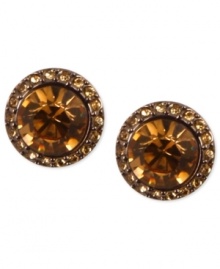 Smoky sophistication stands out on Givenchy's stud earrings. A light Colorado topaz glass stone is surrounded by pave accents. Crafted in brown gold tone mixed metal. Approximate diameter: 1-1/2 inches. Smoky sophistication stands out on Givenchy's stud earrings. A light Colorado topaz glass stone is surrounded by pave accents. Crafted in brown gold tone mixed metal. Approximate diameter: 1-1/2 inches.