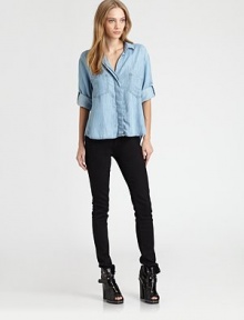 A modern take on the classic button-down shirt, this relaxed chambray shirt has front patch pockets and a split back hem. Point collarHidden button frontFront patch pocketsDropped shouldersLong sleeves with buttoned cuffsSplit back hemTencelMachine washMade in USA of imported fabricModel shown is 5'9 (176cm) wearing US size Small. A modern take on the classic button-down shirt, this relaxed chambray shirt has front patch pockets and a split back hem. Point collarHidden button frontFront patch pocketsDropped shouldersLong sleeves with buttoned cuffsSplit back hemTencelMachine washMade in USA of imported fabricModel shown is 5'9 (176cm) wearing US size Small.