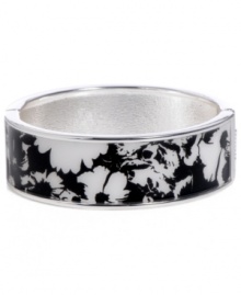 Channel the exoticism and energy of Brasil in Haskell's inspired skinny bangle. The Floral bangle features a black and white flower design, set in silver tone mixed metal with a hinge clasp. Approximate diameter: 2-1/2 inches. Approximate length: 8 inches. Item comes packaged in a turquoise gift box. Channel the exoticism and energy of Brasil in Haskell's inspired skinny bangle. The Floral bangle features a black and white flower design, set in silver tone mixed metal with a hinge clasp. Approximate diameter: 2-1/2 inches. Approximate length: 8 inches. Item comes packaged in a turquoise gift box.