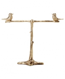 Perched with panache. Fossil's tree stand with two birds makes a stylish piece of decor for any room. Crafted in gold tone mixed metal. Approximate length: 5-1/4 inches. Perched with panache. Fossil's tree stand with two birds makes a stylish piece of decor for any room. Crafted in gold tone mixed metal. Approximate length: 5-1/4 inches.