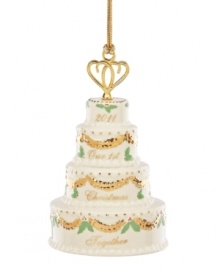 How sweet. Cherish your first Christmas together with this special Lenox cake ornament. Four tiers of ivory porcelain decorated with brilliant gold and festive holly make it a gift any happy couple will cherish. Qualifies for Rebate How sweet. Cherish your first Christmas together with this special Lenox cake ornament. Four tiers of ivory porcelain decorated with brilliant gold and festive holly make it a gift any happy couple will cherish. Qualifies for Rebate