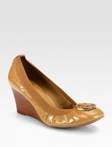 A slouchy patent leather shape with a stacked wedge, elasticized trim and bicolor medallion at the toe. Stacked wedge, 2½ (65mm)Patent leather upper with elastic trimLeather liningRubber solePadded insoleImported A slouchy patent leather shape with a stacked wedge, elasticized trim and bicolor medallion at the toe. Stacked wedge, 2½ (65mm)Patent leather upper with elastic trimLeather liningRubber solePadded insoleImported