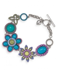 Infuse your look with a springtime touch. Carolee's breezy bracelet features an intricate floral pattern with plastic beading in bright blue and pastel hues. Crafted in silver tone mixed metal with a toggle and bar clasp. Approximate 7-3/4 inches. Infuse your look with a springtime touch. Carolee's breezy bracelet features an intricate floral pattern with plastic beading in bright blue and pastel hues. Crafted in silver tone mixed metal with a toggle and bar clasp. Approximate 7-3/4 inches.