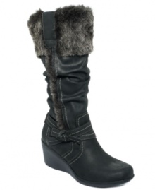 Take on the cold feet-first. Clarks' Artisan Saddle Ride faux-fur wedge boots feature a slouchy shaft and wrapped bow detail. Take on the cold feet-first. Clarks' Artisan Saddle Ride faux-fur wedge boots feature a slouchy shaft and wrapped bow detail.