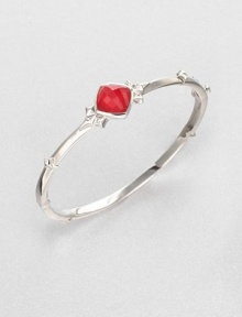 From the Superstud Collection. A sleek bangle of sterling silver with a white rhodium finish is dotted with spiked studs and highlighted by a faceted center stone layered with clear quartz crystal and coral-color glass crystal.Clear quartz crystalRed coral-color crystalRhodium-plated sterling silverDiameter, about 2.25Hinged with push-lock claspImported From the Superstud Collection. A sleek bangle of sterling silver with a white rhodium finish is dotted with spiked studs and highlighted by a faceted center stone layered with clear quartz crystal and coral-color glass crystal.Clear quartz crystalRed coral-color crystalRhodium-plated sterling silverDiameter, about 2.25Hinged with push-lock claspImported