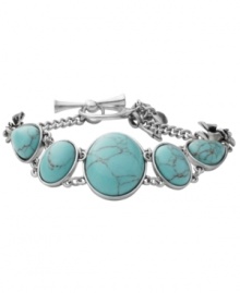 Breezy, bohemian style. Perfect for the free spirit, Fossil's trendy toggle bracelet includes reconstituted turquoise stones set in vintage silver tone mixed metal bezels with orchid details. Approximate length: 8 inches. Breezy, bohemian style. Perfect for the free spirit, Fossil's trendy toggle bracelet includes reconstituted turquoise stones set in vintage silver tone mixed metal bezels with orchid details. Approximate length: 8 inches.