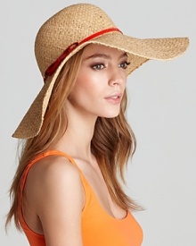Juicy Couture's woven straw floppy hat with a contrast red patent band and bow detail for a ladylike touch. Juicy Couture's woven straw floppy hat with a contrast red patent band and bow detail for a ladylike touch.