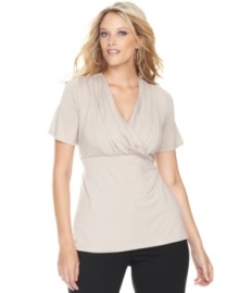 An essential component for any wardrobe, INC's classic plus size surplice top features flattering ruched sides for a feminine, soft look. An essential component for any wardrobe, INC's classic plus size surplice top features flattering ruched sides for a feminine, soft look.