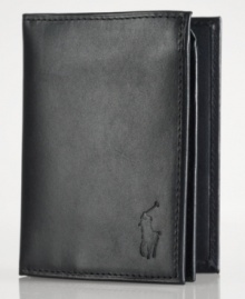 Ralph Lauren's iconic pony graces the front of a lustrous leather billfold wallet, constructed with ample storage for cards and a convenient ID window. Ralph Lauren's iconic pony graces the front of a lustrous leather billfold wallet, constructed with ample storage for cards and a convenient ID window.