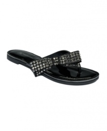 A glittering side bow adds pizazz to the Giselle flat thong sandals by INC International Concepts. A glittering side bow adds pizazz to the Giselle flat thong sandals by INC International Concepts.