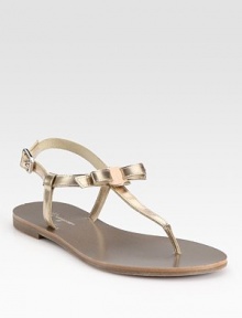 Adjustable metallic leather straps, sweetened by a dainty bow. Metallic leather upperLeather liningRubber solePadded insoleMade in ItalyOUR FIT MODEL RECOMMENDS ordering one half size down as this style runs large. Adjustable metallic leather straps, sweetened by a dainty bow. Metallic leather upperLeather liningRubber solePadded insoleMade in ItalyOUR FIT MODEL RECOMMENDS ordering one half size down as this style runs large.