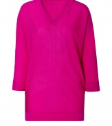 Paint bright color into your chic knitwear collection with DKNYs hot pink pullover - V-neckline, 3/4 sleeves, front and back seams, fine ribbed trim - Long, lean fit - Wear with favorite skinnies with sleek ankle boots