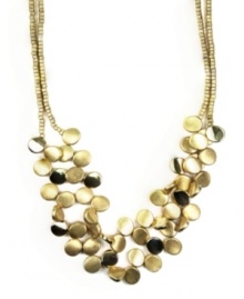 Capture a look that's out of this world. Make a stunning statement in chic, circular style. Necklace by Jones New York features two rows of clustered discs. Setting and chain crafted in worn gold tone mixed metal. Approximate length: 17 inches. Approximate drop: 3 inches. Capture a look that's out of this world. Make a stunning statement in chic, circular style. Necklace by Jones New York features two rows of clustered discs. Setting and chain crafted in worn gold tone mixed metal. Approximate length: 17 inches. Approximate drop: 3 inches.