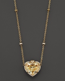 A heart-shaped canary crystal pendant framed by diamond pave accents drops from an 18K gold chain with decorative diamond stations. By Judith Ripka. A heart-shaped canary crystal pendant framed by diamond pave accents drops from an 18K gold chain with decorative diamond stations. By Judith Ripka.