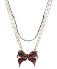Tie something new. This shimmering bow pendant from Betsey Johnson makes a perfect present for yourself or a loved one. The necklace is crafted from gold and hematite tone mixed metal and features a crystal cup chain accent. Approximate length: 16 inches + 3-inch extender. Approximate drop: 2 inches. Tie something new. This shimmering bow pendant from Betsey Johnson makes a perfect present for yourself or a loved one. The necklace is crafted from gold and hematite tone mixed metal and features a crystal cup chain accent. Approximate length: 16 inches + 3-inch extender. Approximate drop: 2 inches.