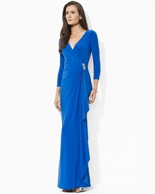 Effortlessly stunning in a glamorous floor-length silhouette with an elegant knot detail at the front, this gown is rendered in light, airy matte jersey for graceful movement. Effortlessly stunning in a glamorous floor-length silhouette with an elegant knot detail at the front, this gown is rendered in light, airy matte jersey for graceful movement.