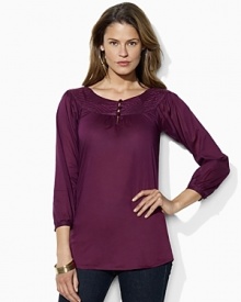 Rendered in light-as-air cotton voile, a feminine top draws inspiration from vintage peasant blouses with an embellished boat neckline and chic knotted buttons. Rendered in light-as-air cotton voile, a feminine top draws inspiration from vintage peasant blouses with an embellished boat neckline and chic knotted buttons.