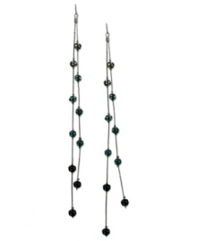 Fire up your evening with these two-row linear earrings from GUESS. Montana, blue zircon and aqua crystal-embellished fireballs hang from metal chains. Crafted in sprayed jet mixed metal. Approximate drop: 7 inches. Fire up your evening with these two-row linear earrings from GUESS. Montana, blue zircon and aqua crystal-embellished fireballs hang from metal chains. Crafted in sprayed jet mixed metal. Approximate drop: 7 inches.