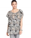 Add dramatic flair to your casual look with Style&co.'s short sleeve plus size top, featuring a vivid print.