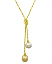 From the island of Mallorca, Spain, this love knot lariat pendant features white and champagne organic man-made baroque pearls (14 mm) set in 18k gold over sterling silver. Approximate length: 16-18 inches. Approximate drop: 1 inch. From the island of Mallorca, Spain, this love knot lariat pendant features white and champagne organic man-made baroque pearls (14 mm) set in 18k gold over sterling silver. Approximate length: 16-18 inches. Approximate drop: 1 inch.