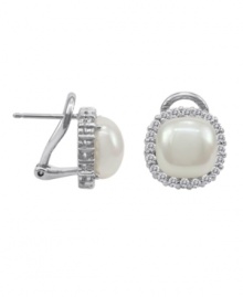 Look positively luminous in sparkling studs. Majorica earrings feature an organic, man-made pearl (9 mm) with a chic, cubic zirconia accented jacket. Setting and post crafted in sterling silver. Look positively luminous in sparkling studs. Majorica earrings feature an organic, man-made pearl (9 mm) with a chic, cubic zirconia accented jacket. Setting and post crafted in sterling silver.