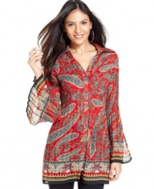 A bold paisley print and pleated detail makes this tunic-style top from Sunny Leigh a vibrant addition to your wardrobe. A bold paisley print and pleated detail makes this tunic-style top from Sunny Leigh a vibrant addition to your wardrobe.