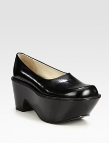 Opt for a lifted yet comfortable leather style with this easy, slip-on wedge silhouette. Self-covered wedge, 3 (75mm)Covered platform, 2½ (65mm)Compares to a ½ heel (15mm)Leather upperLeather lining and solePadded insoleImported Opt for a lifted yet comfortable leather style with this easy, slip-on wedge silhouette. Self-covered wedge, 3 (75mm)Covered platform, 2½ (65mm)Compares to a ½ heel (15mm)Leather upperLeather lining and solePadded insoleImported