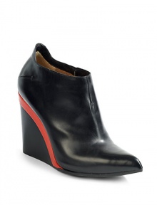 THE LOOKPoint toeConcealed elastic goring on the sideNotched back wedge detailPadded insoleStacked colorblock wedge, 4 (100mm)THE MATERIALLeather upperLeather lining and soleORIGINMade in Italy THE LOOKPoint toeConcealed elastic goring on the sideNotched back wedge detailPadded insoleStacked colorblock wedge, 4 (100mm)THE MATERIALLeather upperLeather lining and soleORIGINMade in Italy