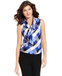 Nine West's classic tie-front blouse gets a fresh look with a chic checked pattern that's perfect for adding punch to your work wardrobe.