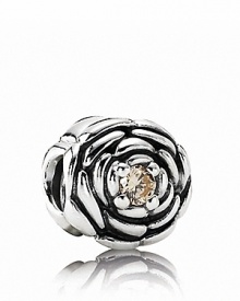 Pandora's delicately carved sterling silver rose charm features a sparking champagne zirconia center. Pandora's delicately carved sterling silver rose charm features a sparking champagne zirconia center.