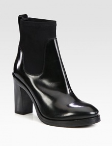 Instantly cool and on-trend, this shiny leather and stretchy neoprene ankle boot is a wardrobe must-have. Stacked heel, 4¼ (110mm)Stacked platform, ½ (15mm)Compares to a 3¾ heel (95mm)Shiny leather and neoprene upperPull-on styleLeather liningRubber solePadded insoleMade in Italy