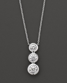 White gold bezel-set diamond necklace in three-stone drop design. With signature ruby accent. Designed by Roberto Coin. White gold bezel-set diamond necklace in three-stone drop design. With signature ruby accent. Designed by Roberto Coin.