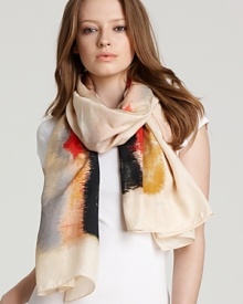 A luxurious silk scarf with an abstract watercolor-like print. A luxurious silk scarf with an abstract watercolor-like print.