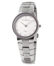 Distinct yet understated, this Skagen Denmark watch carries timeless grace. Silvertone stainless steel bracelet and round case. Round white dial with logo and Swarovski crystal accent indices. Quartz movement. Water resistant to 30 meters. Limited lifetime warranty. Distinct yet understated, this Skagen Denmark watch carries timeless grace. Silvertone stainless steel bracelet and round case. Round white dial with logo and Swarovski crystal accent indices. Quartz movement. Water resistant to 30 meters. Limited lifetime warranty.