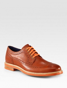 Sharp detailing, contrasting colors and allover perforations makes this sleek oxford design one step ahead of the rest.Leather upperLeather liningPadded insoleRubber soleImported Sharp detailing, contrasting colors and allover perforations makes this sleek oxford design one step ahead of the rest.Leather upperLeather liningPadded insoleRubber soleImported