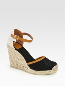 Rich canvas with smooth leather trim forms this classic silhouette, resting on a textured espadrille wedge. Covered wedge, 4 (100mm)Covered platform, ½ (15mm)Compares to a 3½ heel (90mm)Canvas upper with leather trimAdjustable ankle strapCanvas liningRubber solePadded insoleImported Rich canvas with smooth leather trim forms this classic silhouette, resting on a textured espadrille wedge. Covered wedge, 4 (100mm)Covered platform, ½ (15mm)Compares to a 3½ heel (90mm)Canvas upper with leather trimAdjustable ankle strapCanvas liningRubber solePadded insoleImported