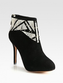 Geometric python cutouts and metal goldtone studs top this buttery suede ankle boot with a hidden platform for superior fit. Self-covered heel, 4¼ (110mm)Hidden platform, ¾ (20mm)Compares to a 3½ heel (90mm)Suede upper with python cutouts and gold metal studsBack zipLeather lining and solePadded insoleImported Geometric python cutouts and metal goldtone studs top this buttery suede ankle boot with a hidden platform for superior fit. Self-covered heel, 4¼ (110mm)Hidden platform, ¾ (20mm)Compares to a 3½ heel (90mm)Suede upper with python cutouts and gold metal studsBack zipLeather lining and solePadded insoleImported