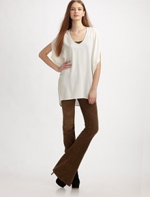 Oversized construction adds a draped feel to this pure silk style. V-neck Split dolman sleeves Hi-low hem Silk Dry clean Imported Oversized construction adds a draped feel to this pure silk style. V-neck Split dolman sleeves Hi-low hem Silk Dry clean Imported