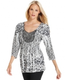 A sparkling beaded applique at the neck elevates this Style&co. top while a sublimated animal print adds an edgy spin. A sparkling beaded applique at the neck elevates this Style&co. top while a sublimated animal print adds an edgy spin.