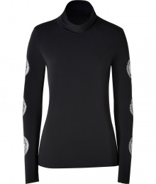 Hit the slopes in ultra chic style in Jet Sets soft black stretch ski top - Softly draped turtleneck, long sleeves with silver star circle print, raw finished seams - Form fitting - Team with bright white ski pants, aviators, and a finish of fur trimmed accessories Hit the slopes in ultra chic style in Jet Sets soft black stretch ski top - Softly draped turtleneck, long sleeves with silver star circle print, raw finished seams - Form fitting - Team with bright white ski pants, aviators, and a finish of fur trimmed accessories