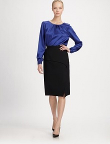 This shiny, silk-blend, textured design is adorned with front pleats for elegant style.Jewel necklineLong sleeves with button cuffsBack eye buttonPleated bodice55% acetate/45% silkDry cleanMade in Italy of imported fabric Model shown is 5'11 wearing US size 4. This shiny, silk-blend, textured design is adorned with front pleats for elegant style.Jewel necklineLong sleeves with button cuffsBack eye buttonPleated bodice55% acetate/45% silkDry cleanMade in Italy of imported fabric Model shown is 5'11 wearing US size 4.